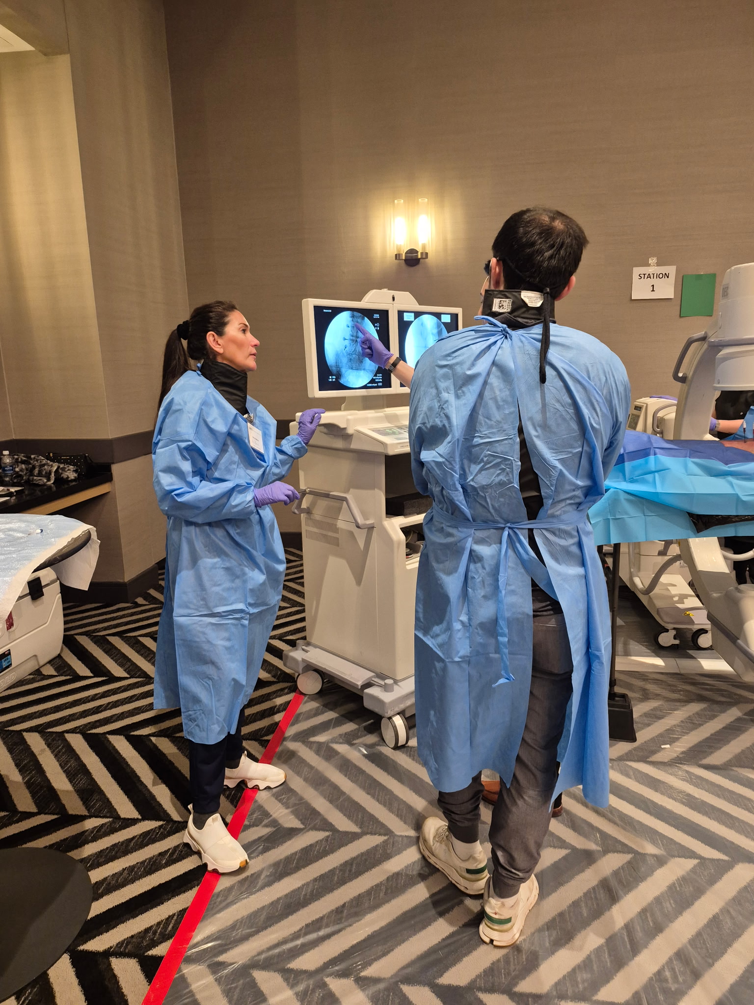 Stratus specialist reviewing fluoroscopy at a training station