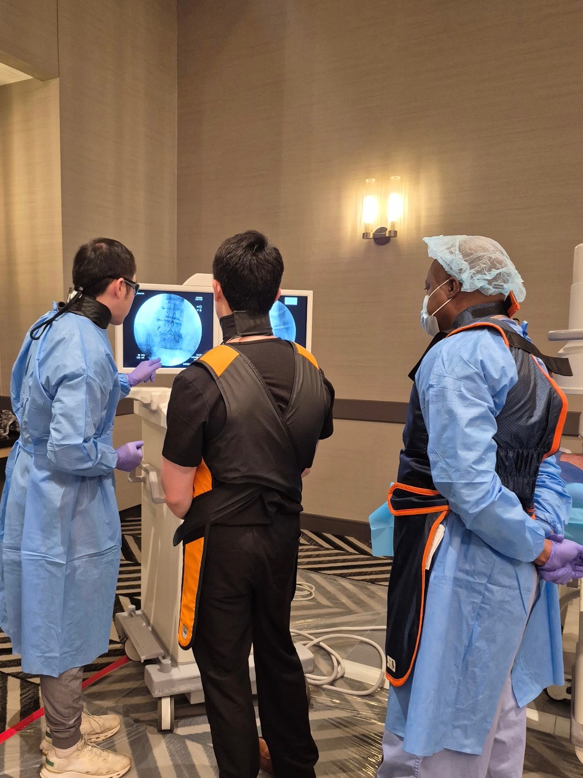 Clinicians reviewing imaging together during a case